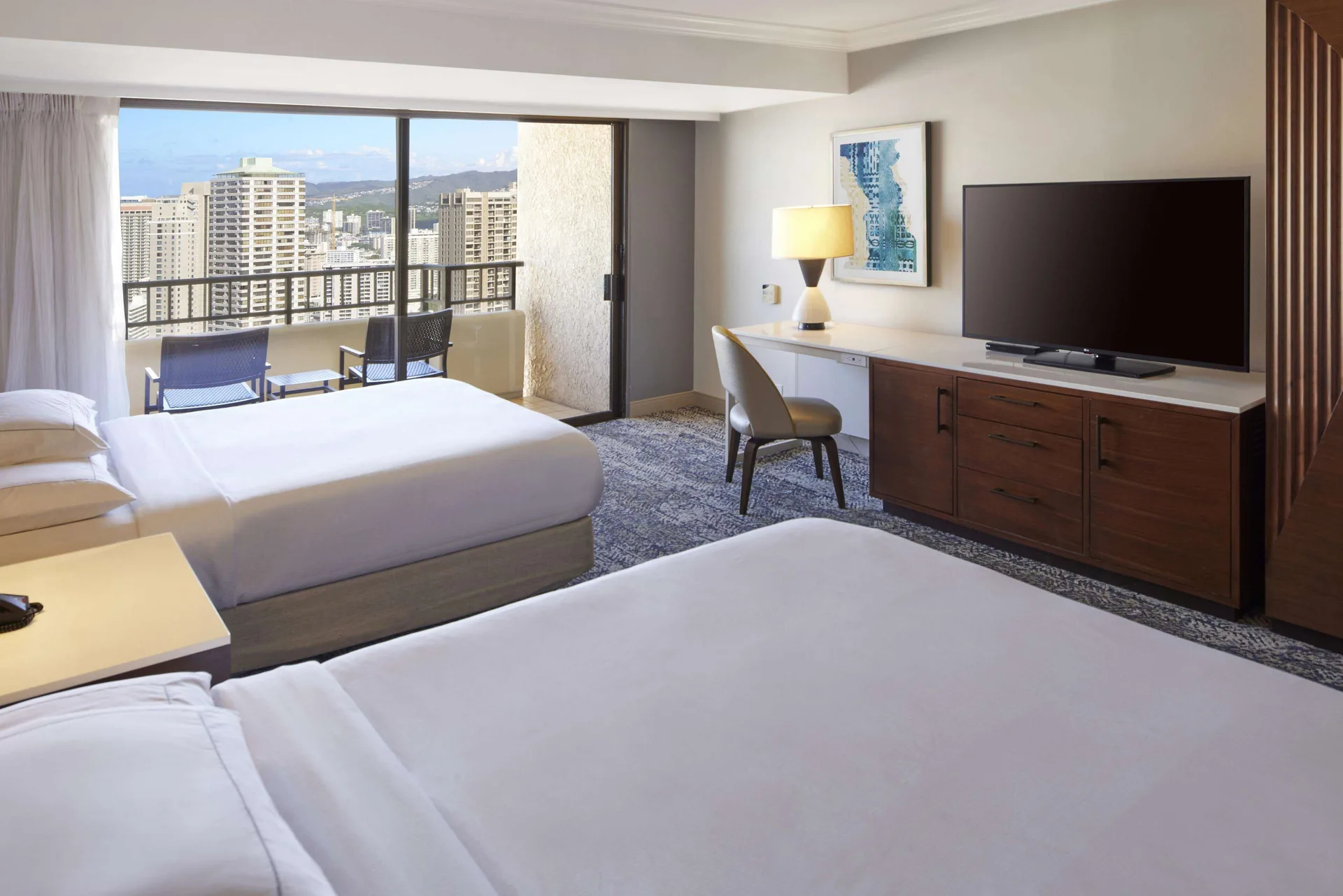 Two-bed room with city and resort views at Hilton Hawaiian Village Waikiki Beach Resort.