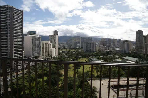 Resort-view balcony overlooking Waikiki buildings at Hilton Hawaiian Village Waikiki Beach Resort.