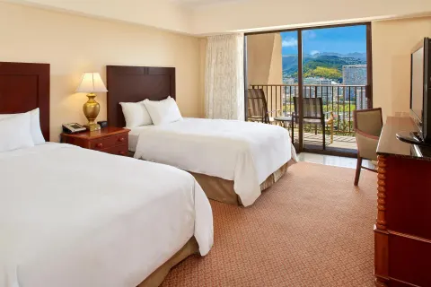 Resort View room with two beds and balcony at Hilton Hawaiian Village Waikiki Beach Resort.