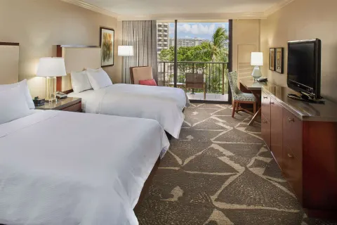 Two-bed resort-view room with desk and balcony at Hilton Hawaiian Village Waikiki Beach Resort.