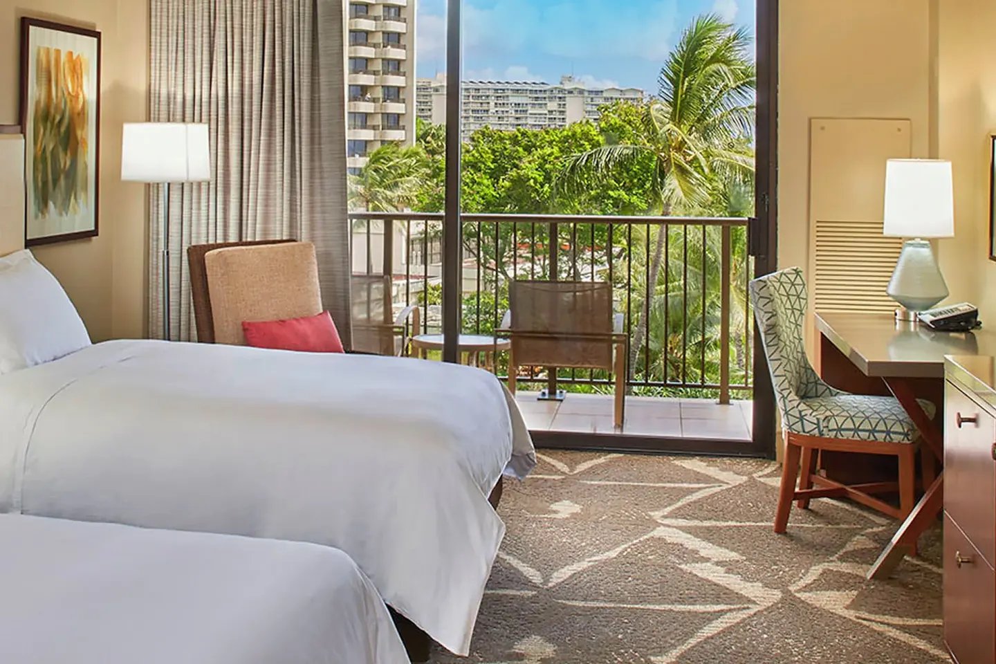 Resort view guest room with two beds and balcony at Hilton Hawaiian Village Waikiki Beach Resort.