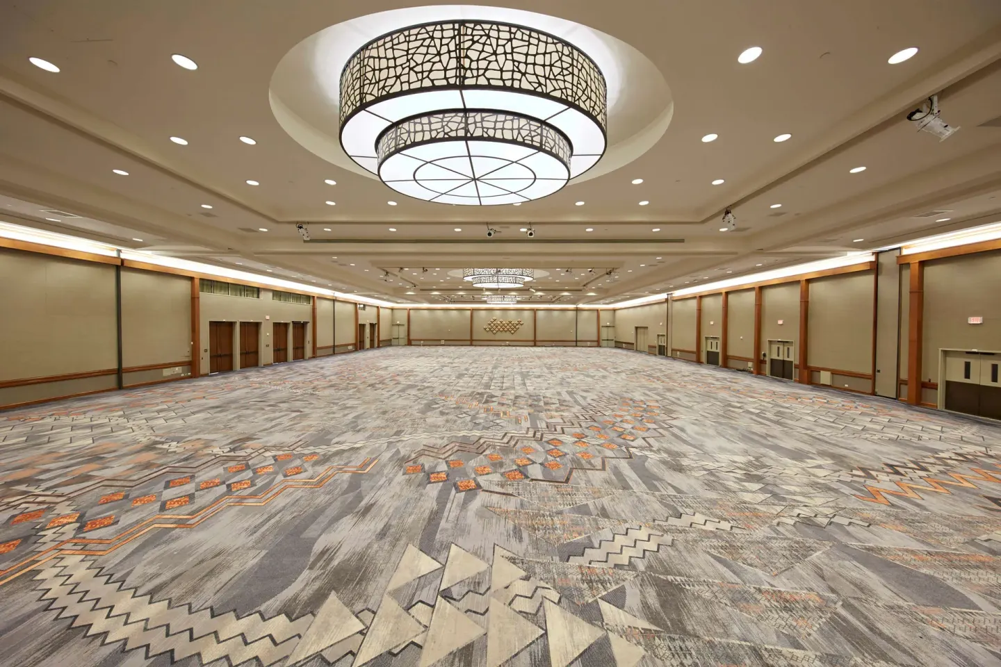 Large ballroom with patterned carpet at Hilton Hawaiian Village Waikiki Beach Resort.