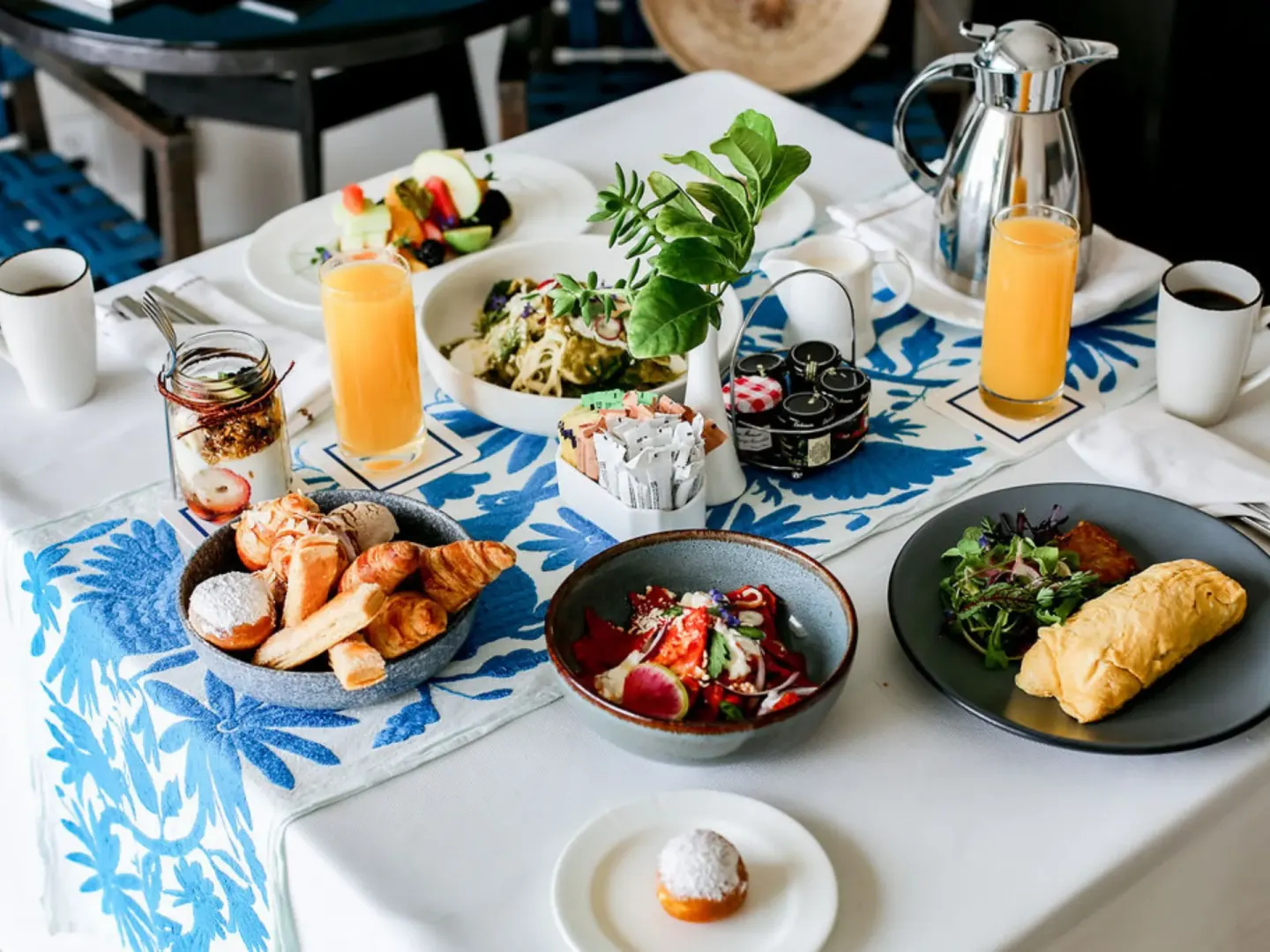 Breakfast spread with pastries, omelet, juices, coffee, and fruit at Hilton Los Cabos.