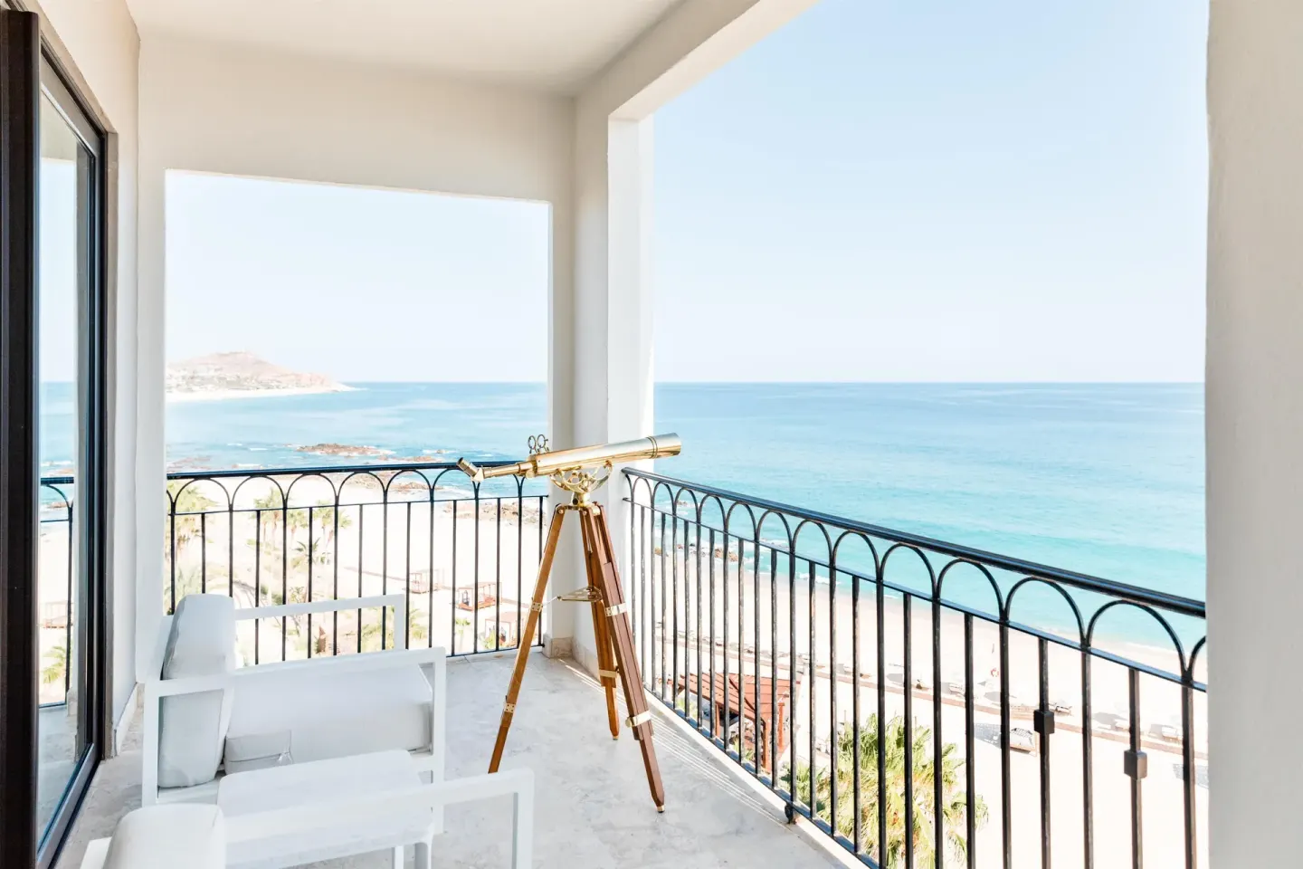 Altamar Governor Suite balcony with telescope and ocean view at Hilton Los Cabos.