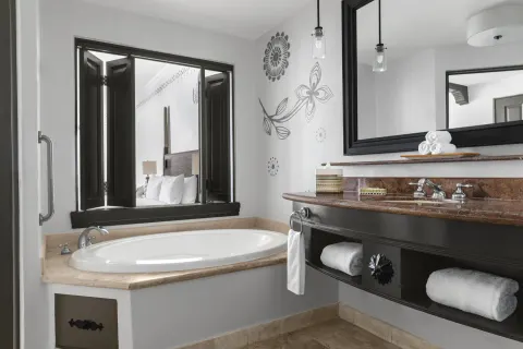 Altamar Junior Suite bathroom with soaking tub and vanity at Hilton Los Cabos.