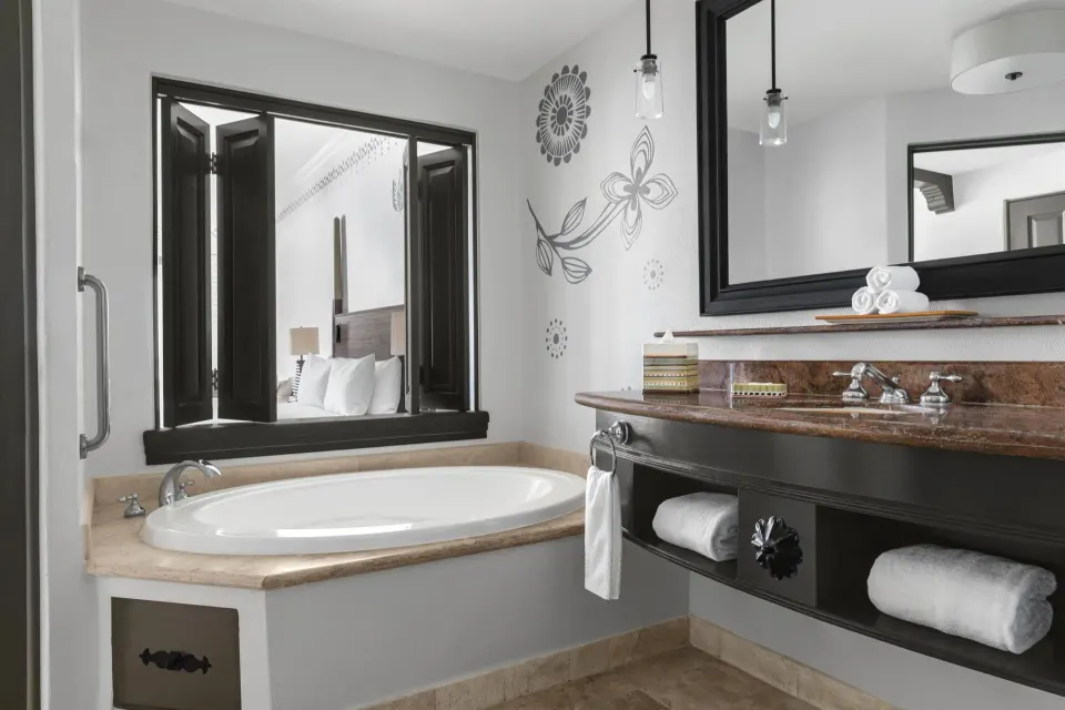 Altamar Junior Suite bathroom with soaking tub and vanity at Hilton Los Cabos.
