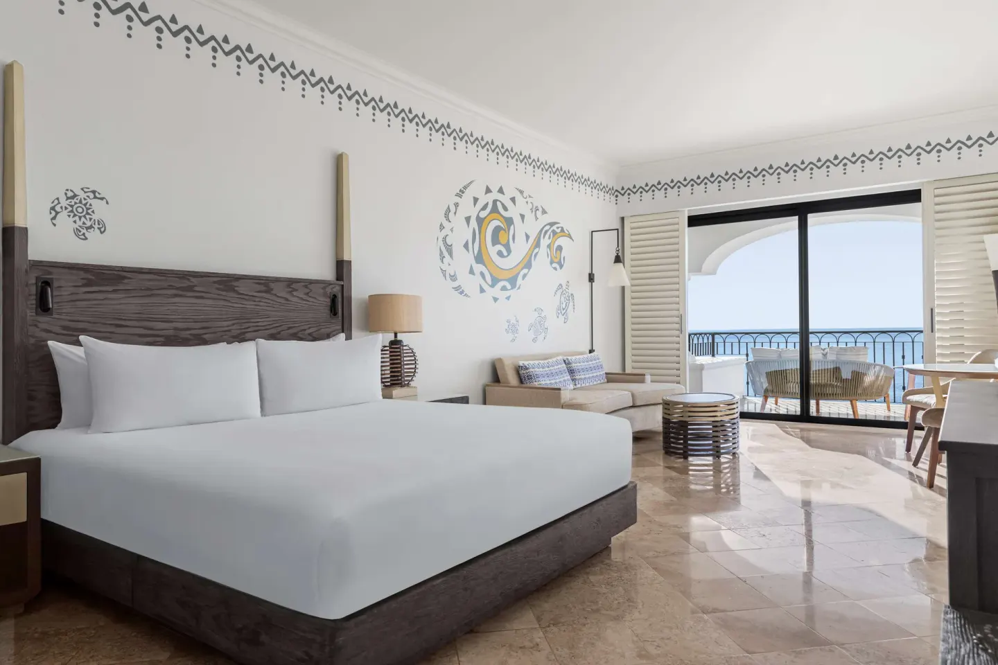 Altamar Junior Suite king bed and balcony ocean view at Hilton Los Cabos.