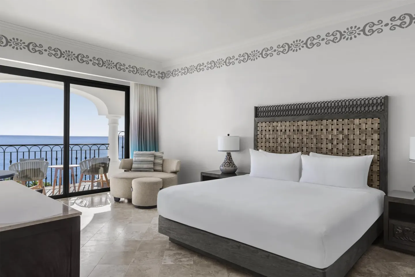 Altamar Premier Suite king bed and ocean view balcony at Hilton Los Cabos.