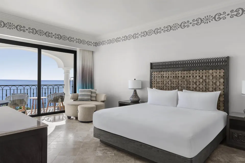 Altamar Premier Suite king bed and ocean view balcony at Hilton Los Cabos.