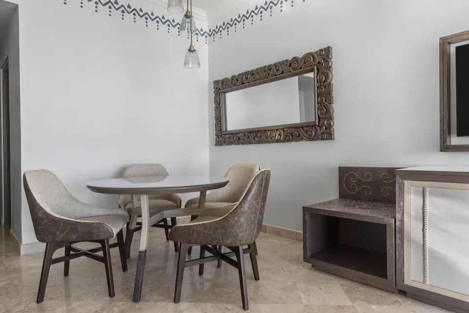 Altamar Premier Suite dining table and carved mirror at Hilton Los Cabos.