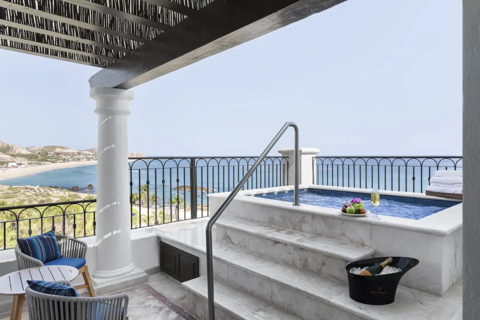 Terrace plunge pool and seating in the Altamar Presidential Suite at Hilton Los Cabos overlooking the coast.