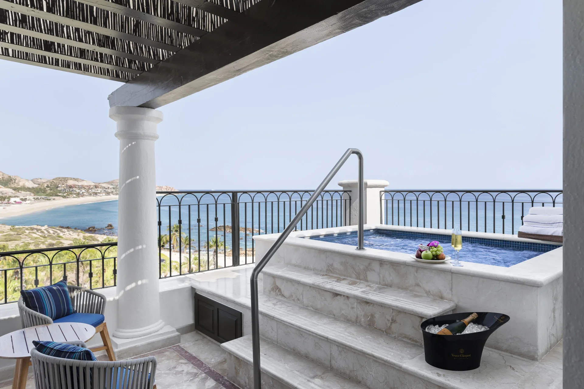 Terrace plunge pool and seating in the Altamar Presidential Suite at Hilton Los Cabos overlooking the coast.