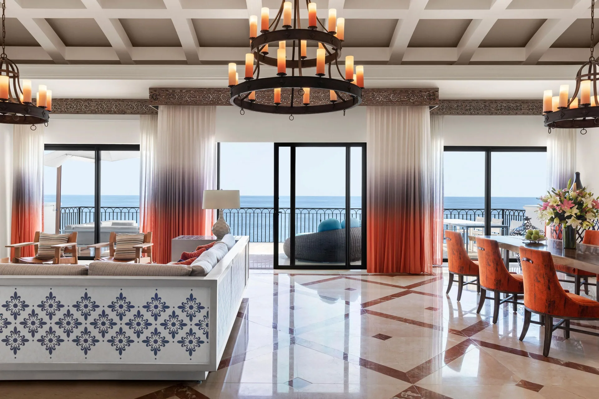 Oceanfront living and dining area in the Altamar Presidential Suite at Hilton Los Cabos.
