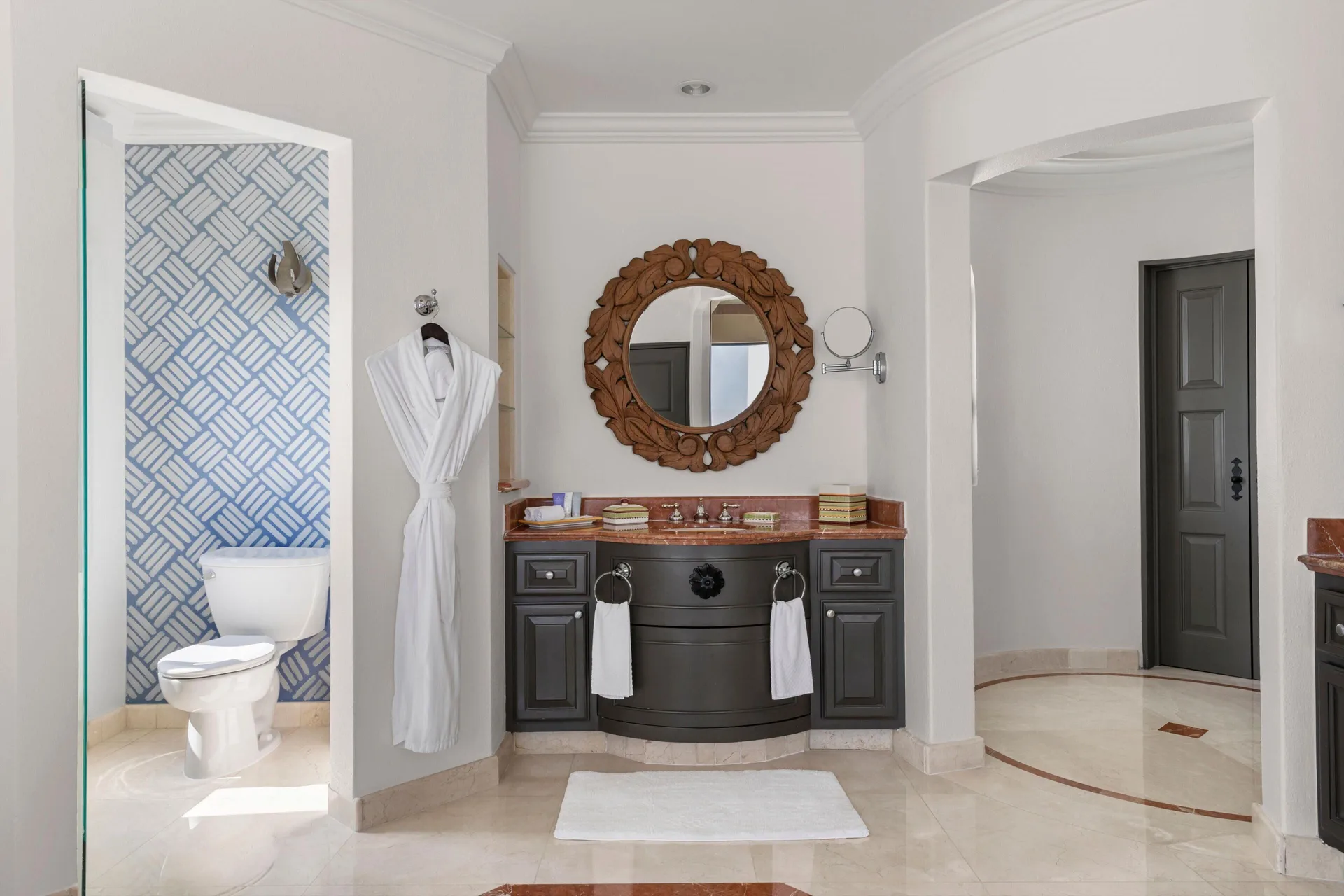 Altamar Presidential Suite bathroom vanity and toilet area at Hilton Los Cabos.