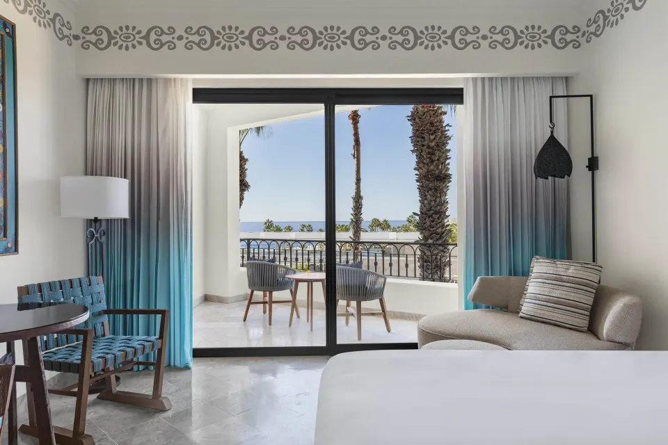 Accessible Deluxe Ocean View room seating area and balcony at Hilton Los Cabos.