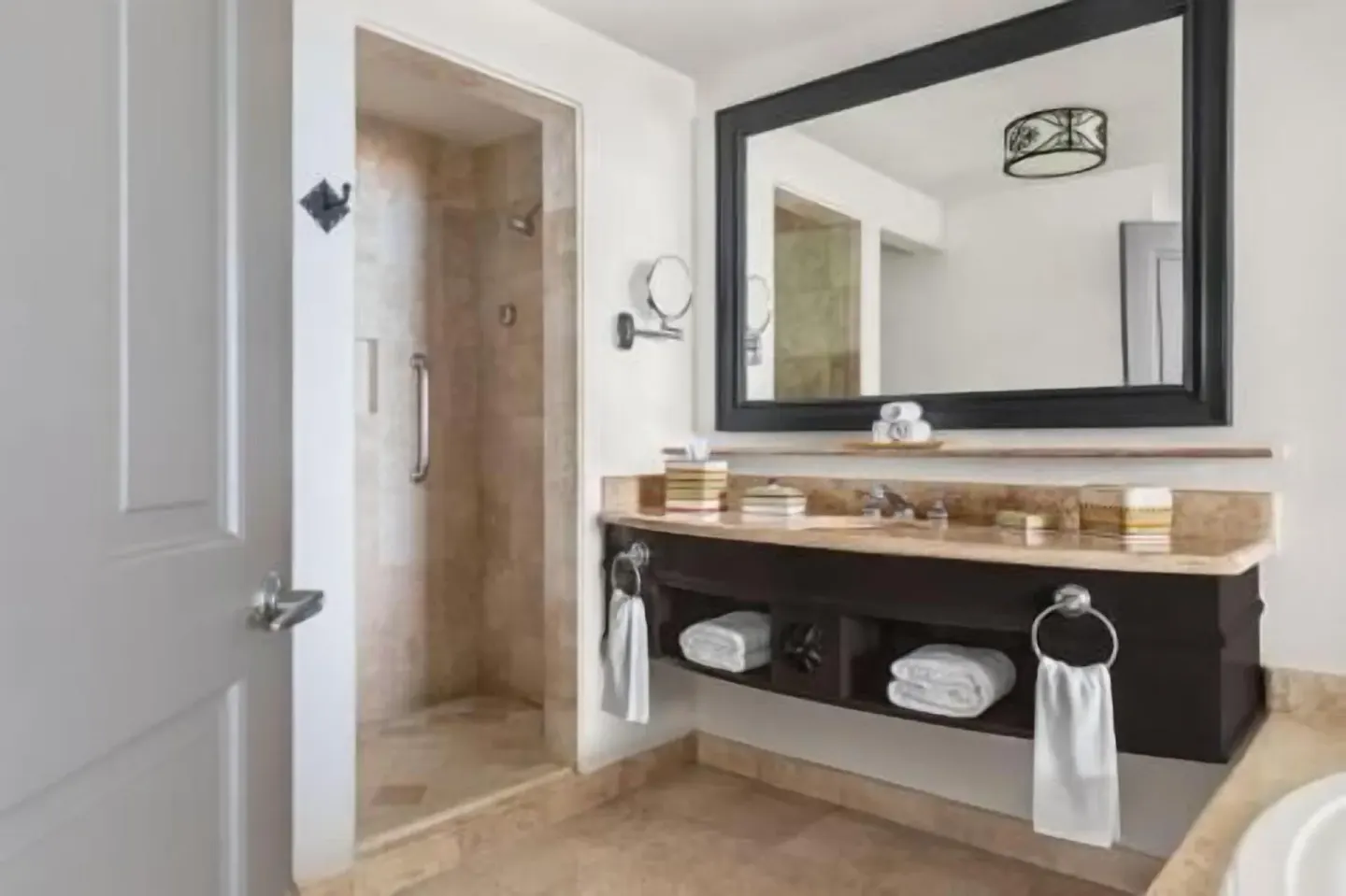 Deluxe Room Coastal Garden View bathroom vanity and shower at Hilton Los Cabos.