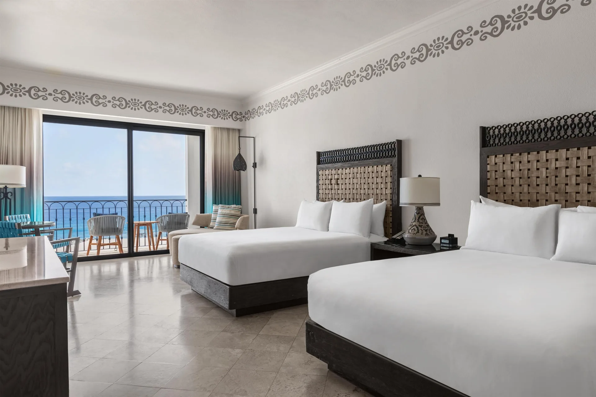 Deluxe Room Ocean View two beds with balcony beyond at Hilton Los Cabos.