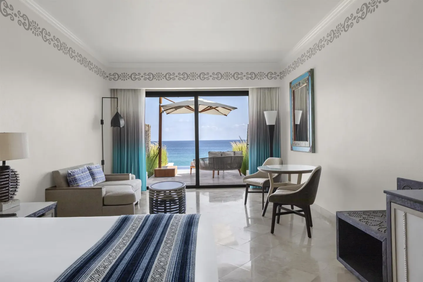 Superior Room at Hilton Los Cabos with bed, sitting area, terrace and ocean view.