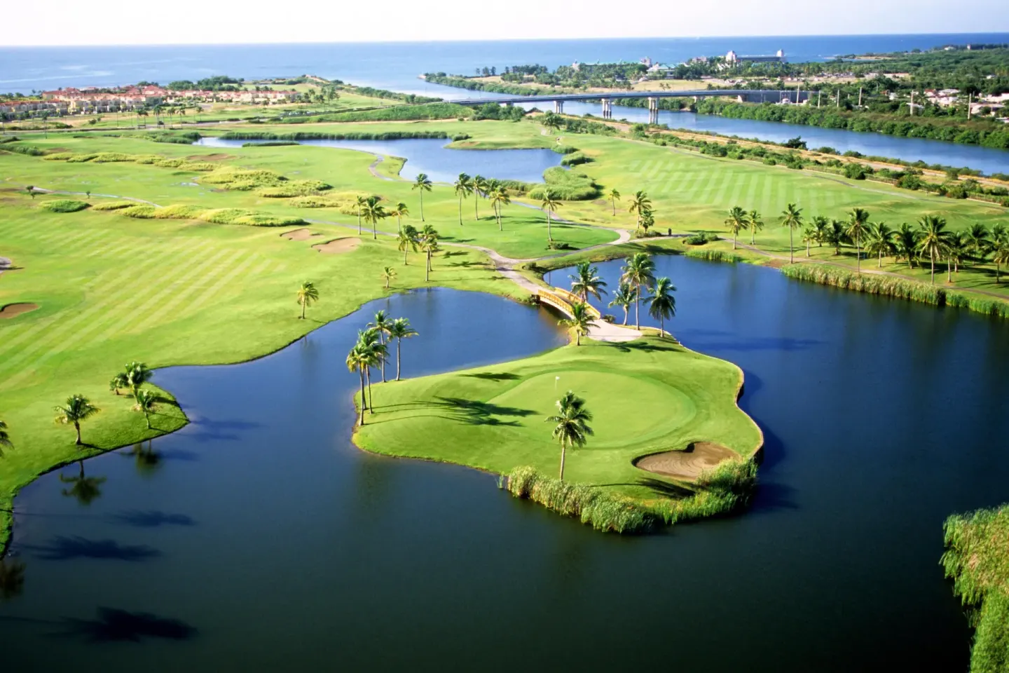 Aerial golf course with lagoons at Hilton Ponce Golf & Casino Resort.
