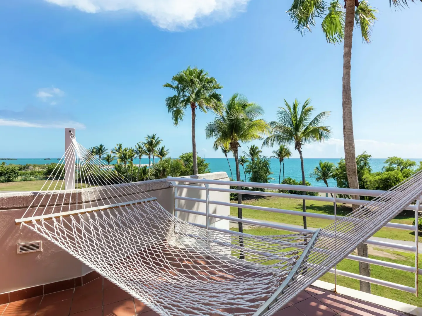 Terrace hammock with palm and ocean views at Hilton Ponce Golf & Casino Resort.