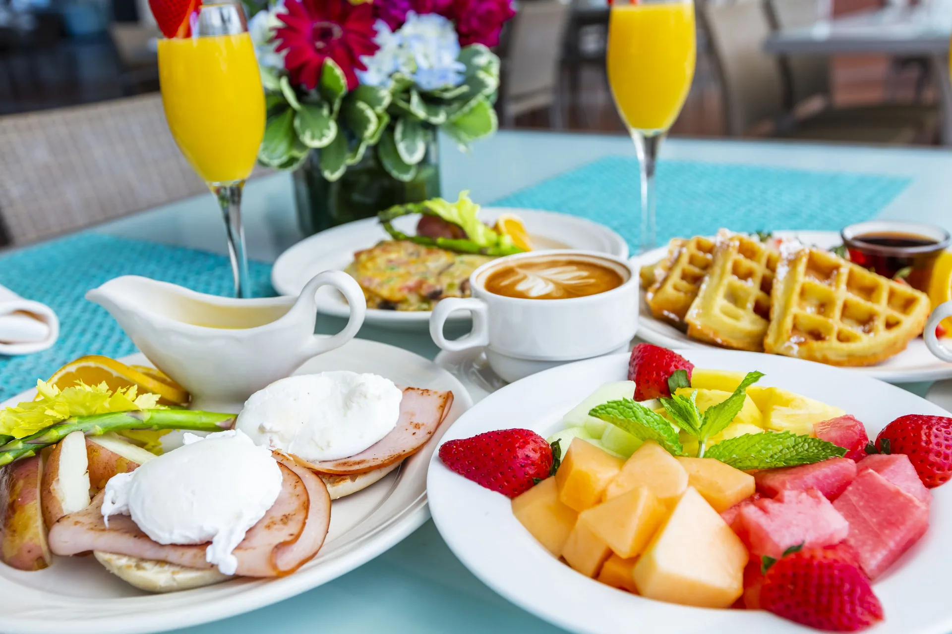 Breakfast plates with fruit, waffles, eggs, coffee and juice at Hilton Ponce Golf & Casino Resort.
