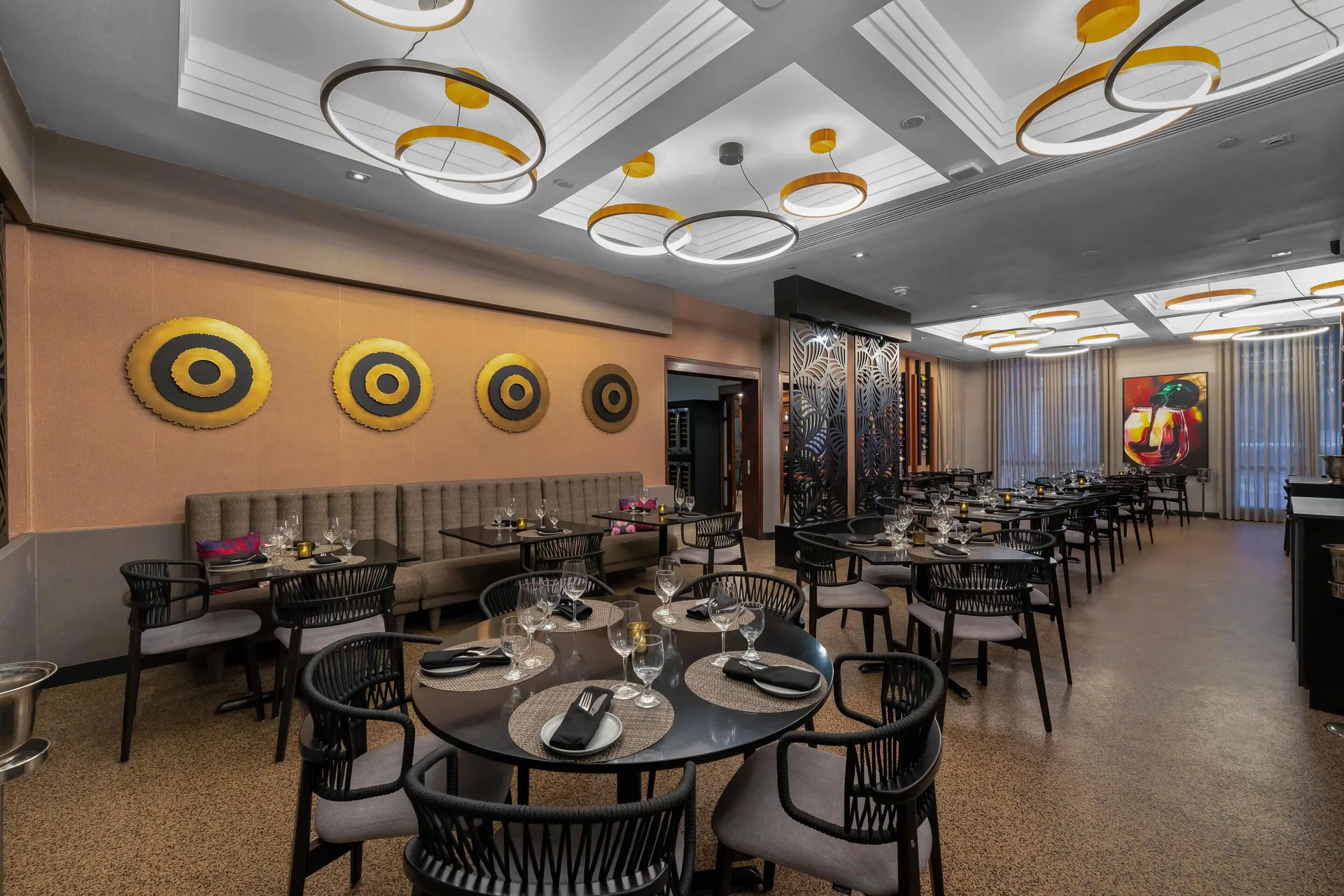 Restaurant dining area with banquette seating at Hilton Ponce Golf & Casino Resort.