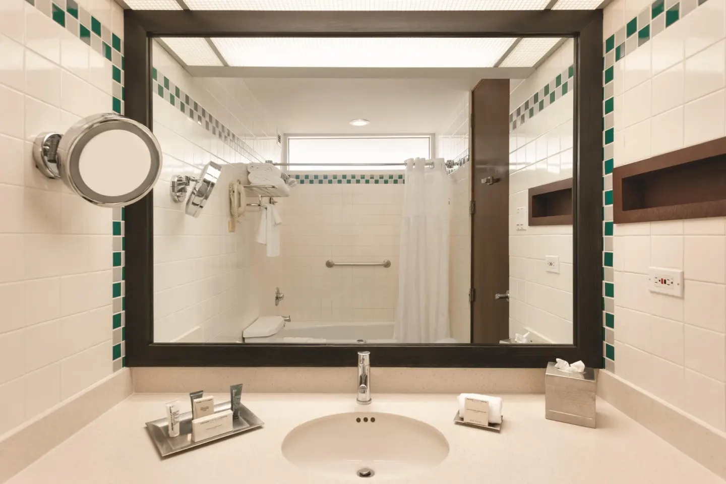 Guest bathroom vanity in a pool view room at Hilton Ponce Golf & Casino Resort.