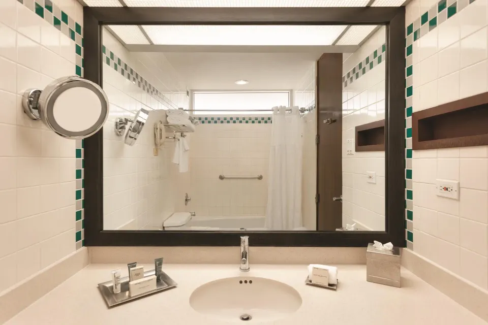 Guest bathroom vanity in a pool view room at Hilton Ponce Golf & Casino Resort.