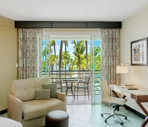 Pool view room sitting area and balcony at Hilton Ponce Golf & Casino Resort.