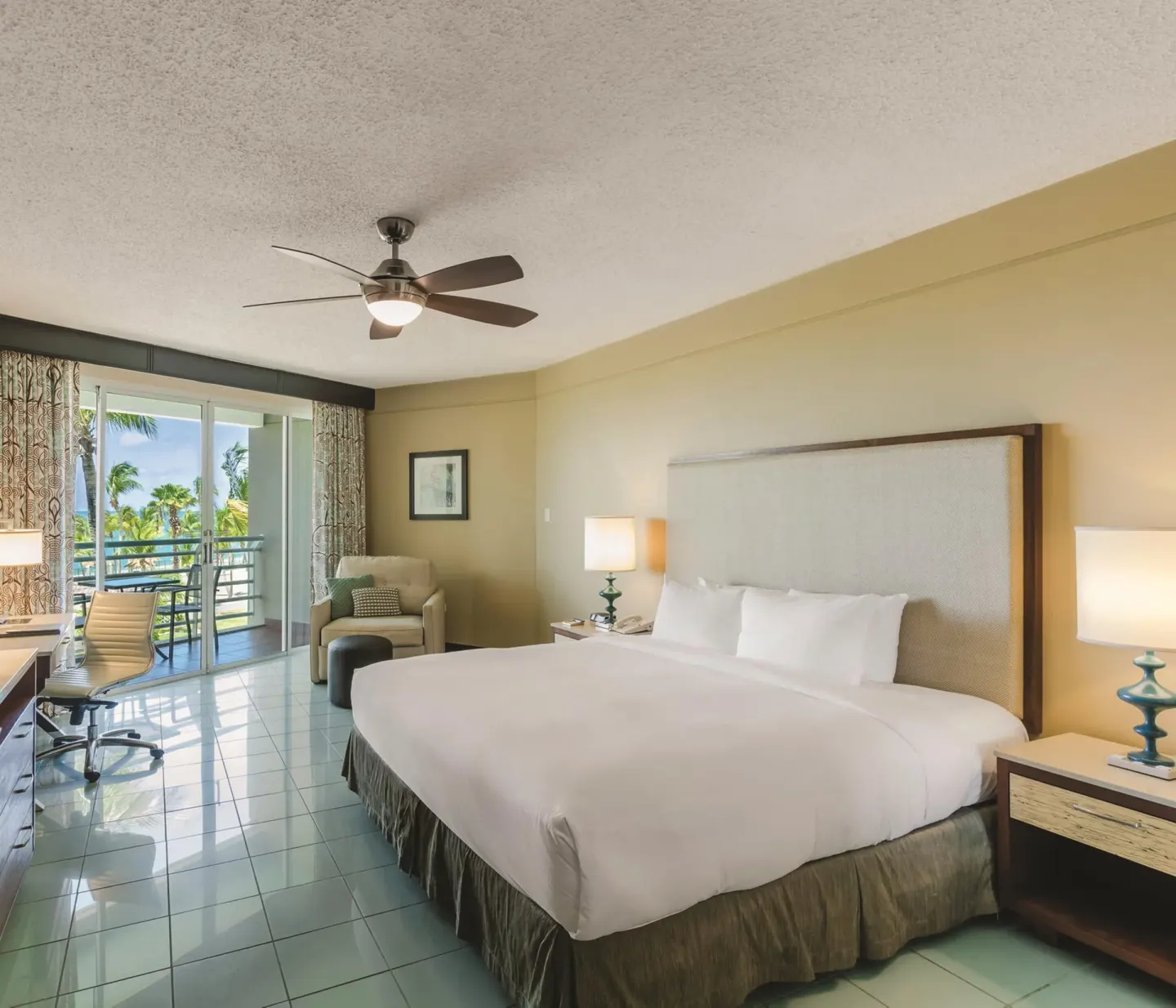 King bed room with balcony pool view at Hilton Ponce Golf & Casino Resort.