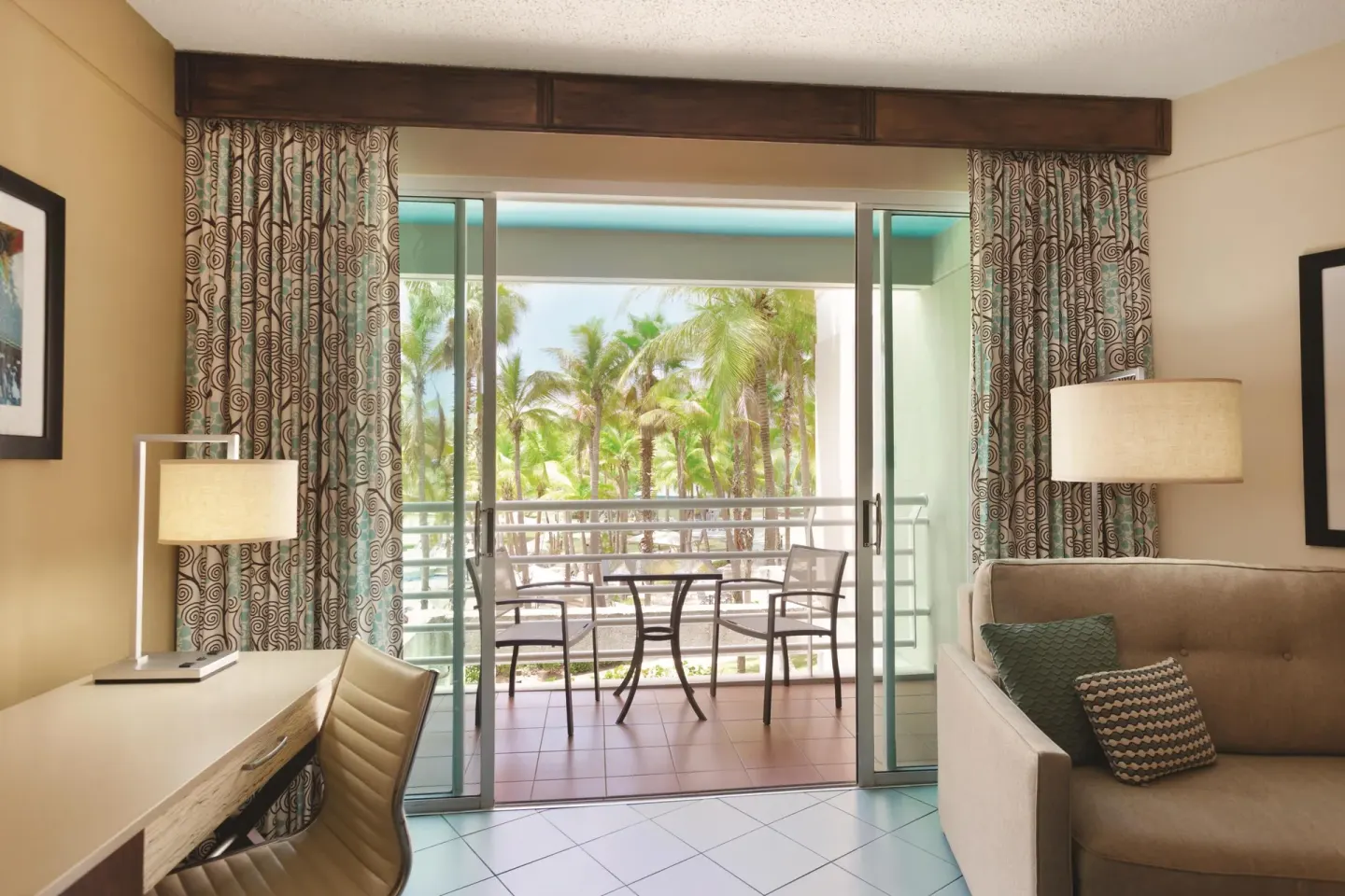 Balcony seating viewed from a pool view room at Hilton Ponce Golf & Casino Resort.