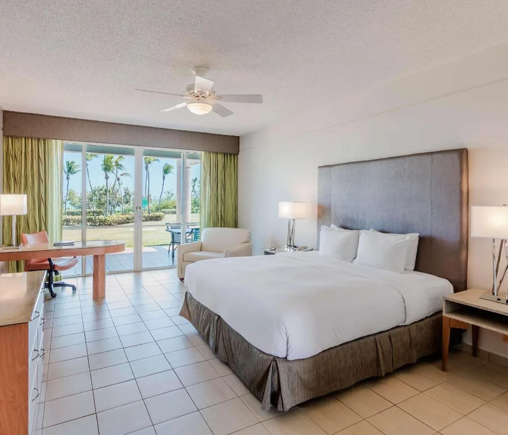 Garden view accessible king guest room with patio at Hilton Ponce Golf & Casino Resort.