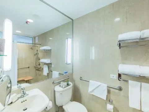 Accessible bathroom with roll-in shower at Hilton Ponce Golf & Casino Resort.