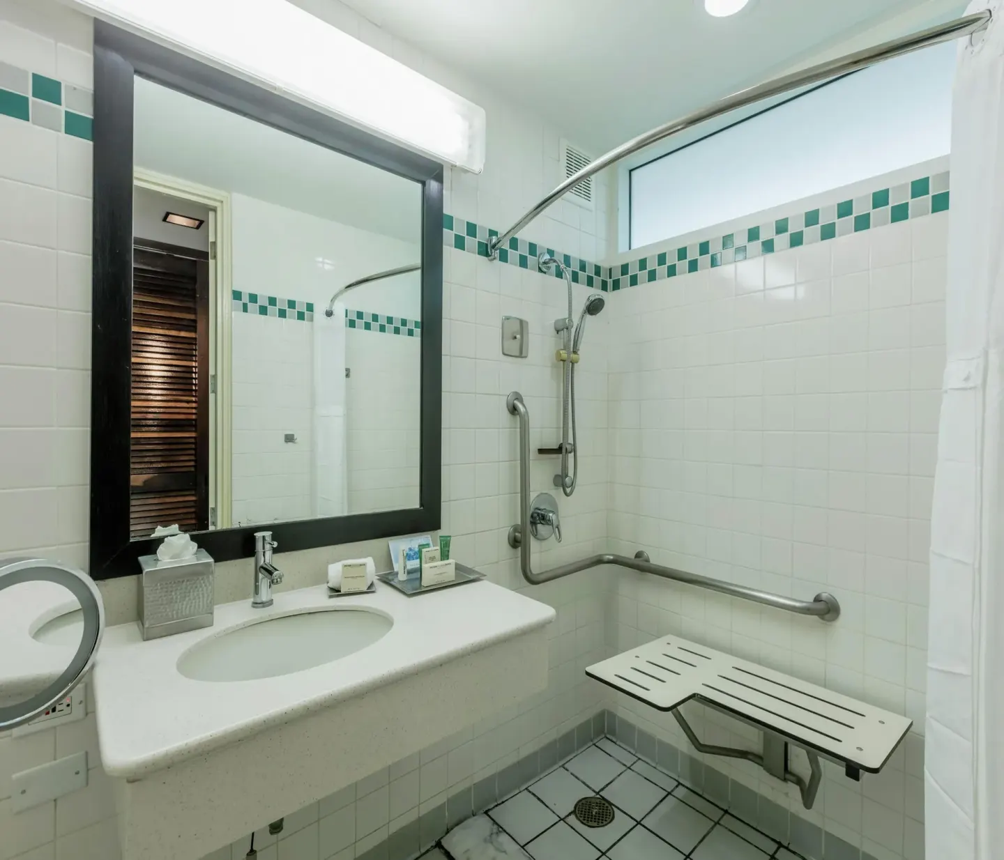 Mobility accessible roll-in shower bathroom at Hilton Ponce Golf & Casino Resort.