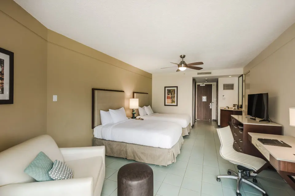 Pool View 2 Mobility Access room with two beds at Hilton Ponce Golf & Casino Resort.