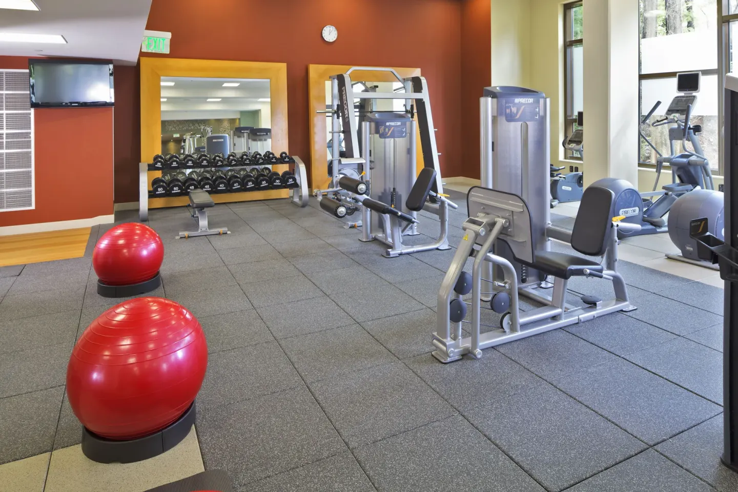 Fitness center strength machines and free weights at Hilton Trinidad & Conference Centre.