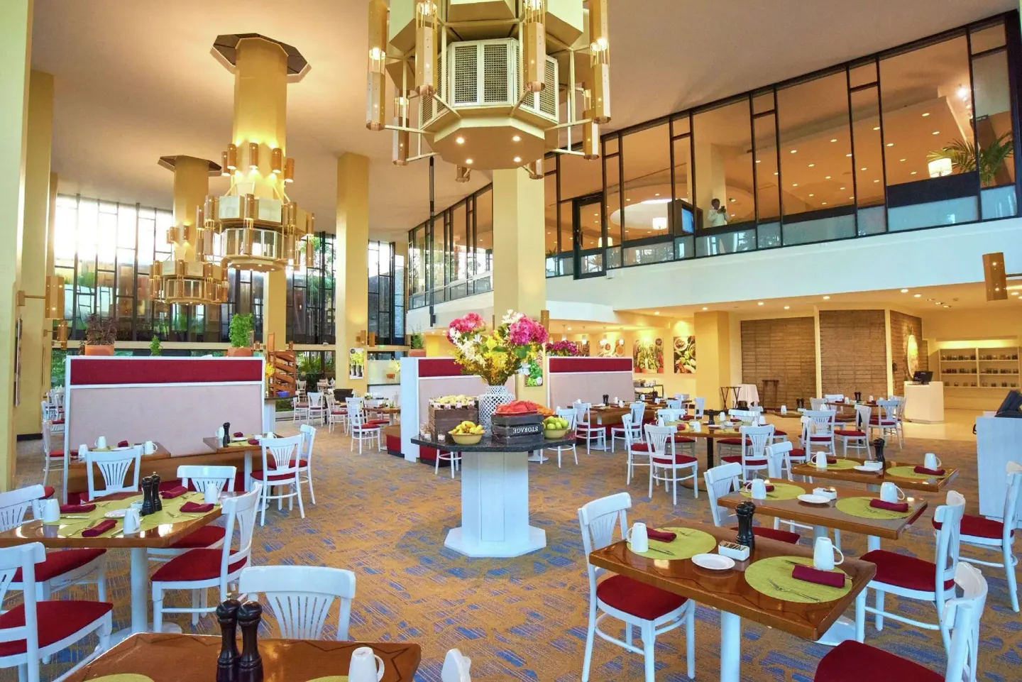 Bright dining room with set tables at Hilton Trinidad & Conference Centre.