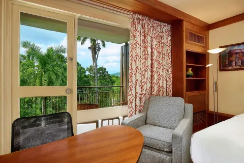 Executive Room sitting area by balcony doors at Hilton Trinidad & Conference Centre.