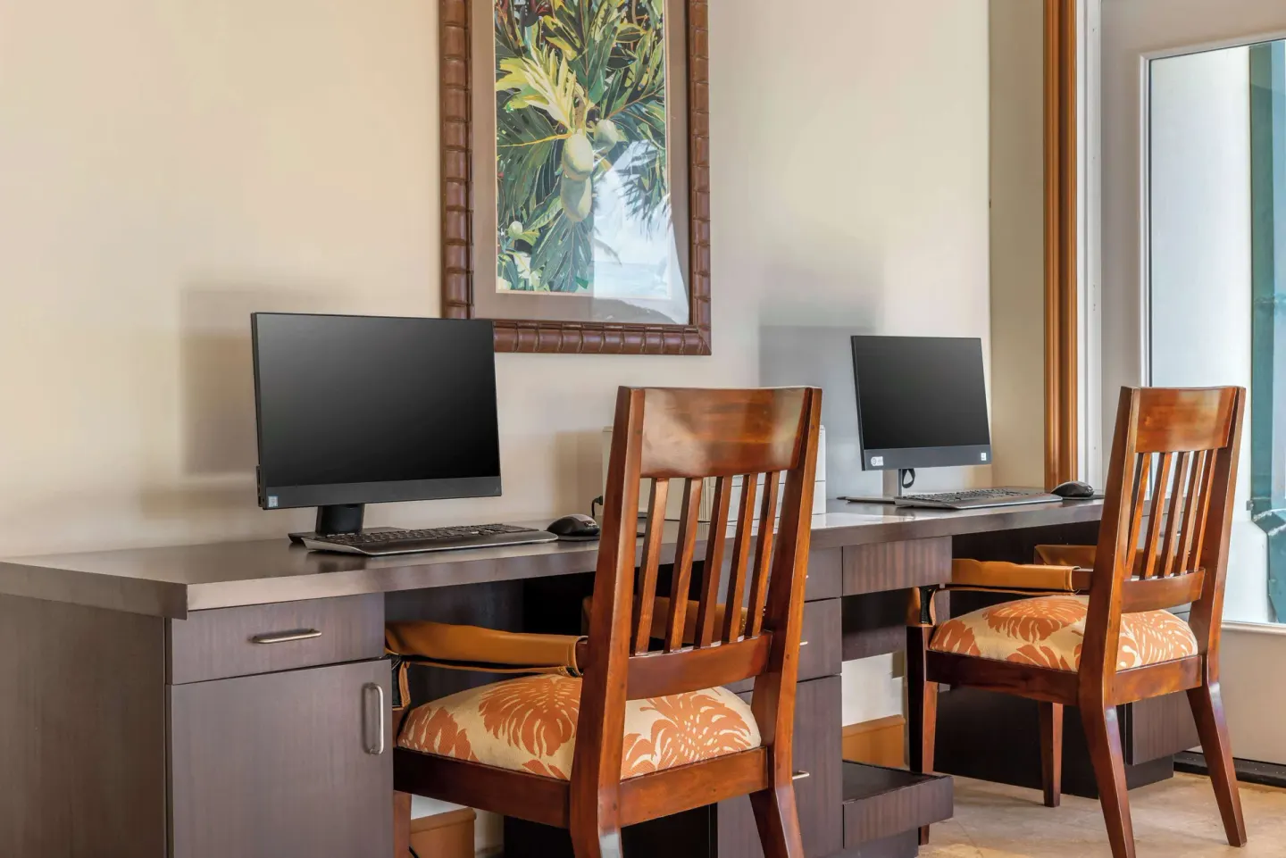 Business center desks with two computers at Hilton Vacation Club The Point At Poipu Kauai.