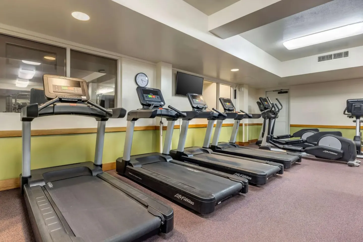 Fitness room treadmills and ellipticals at Hilton Vacation Club The Point At Poipu Kauai.
