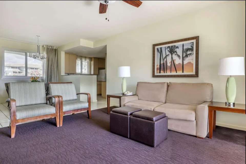 Living and dining area with kitchen at Hilton Vacation Club The Point At Poipu Kauai.
