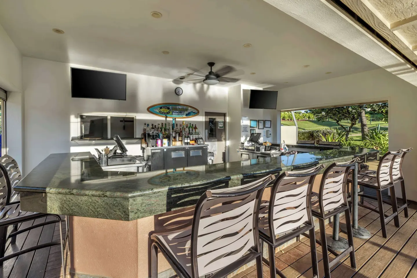 Open-air bar with counter seating at Hilton Vacation Club The Point At Poipu Kauai.