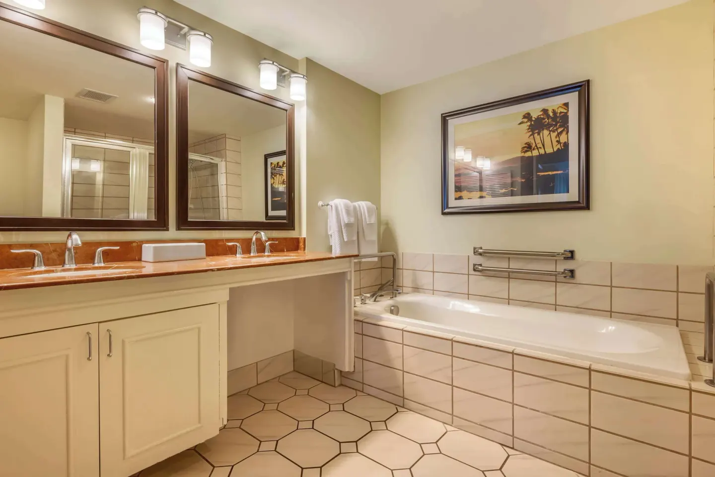 Accessible bathroom with tub and double vanity at Hilton Vacation Club The Point At Poipu Kauai.