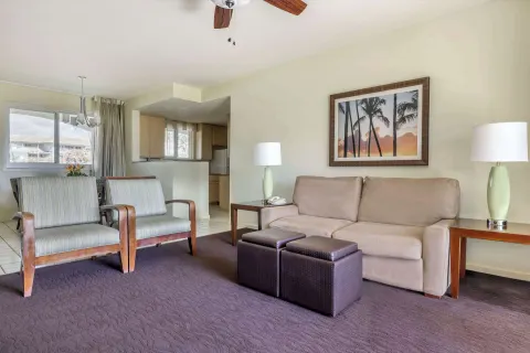 Living room with sofa and dining area at Hilton Vacation Club The Point At Poipu Kauai.