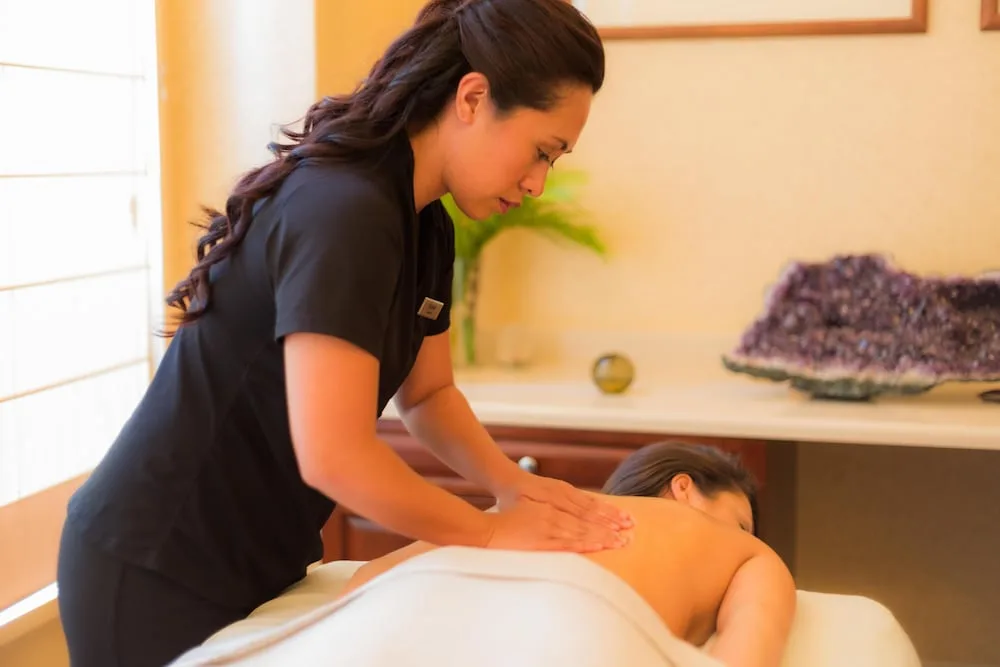 Massage treatment in a spa room at Hilton Waikoloa Village.