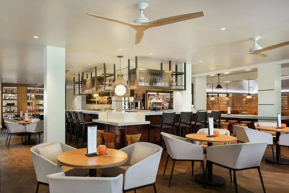 Casual indoor bar and lounge seating at Hilton Waikoloa Village.