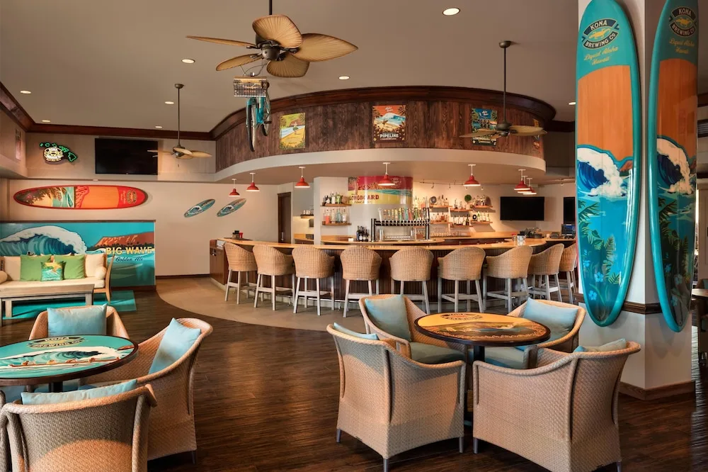 Surf-themed bar with counter seating at Hilton Waikoloa Village.