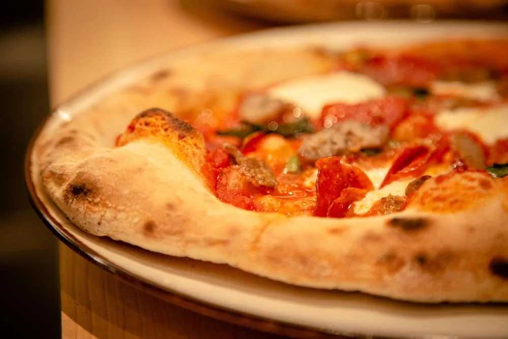 Wood-fired pizza with blistered crust at Hilton Waikoloa Village.