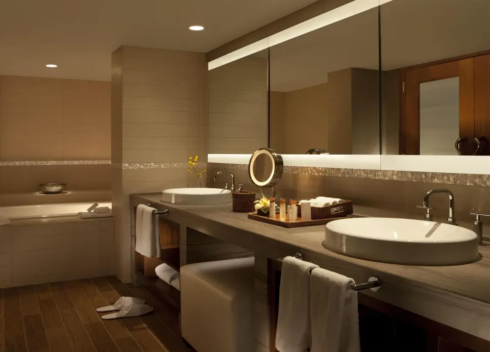 Makai Owner Suite bathroom with double vessel sinks at Hilton Waikoloa Village.