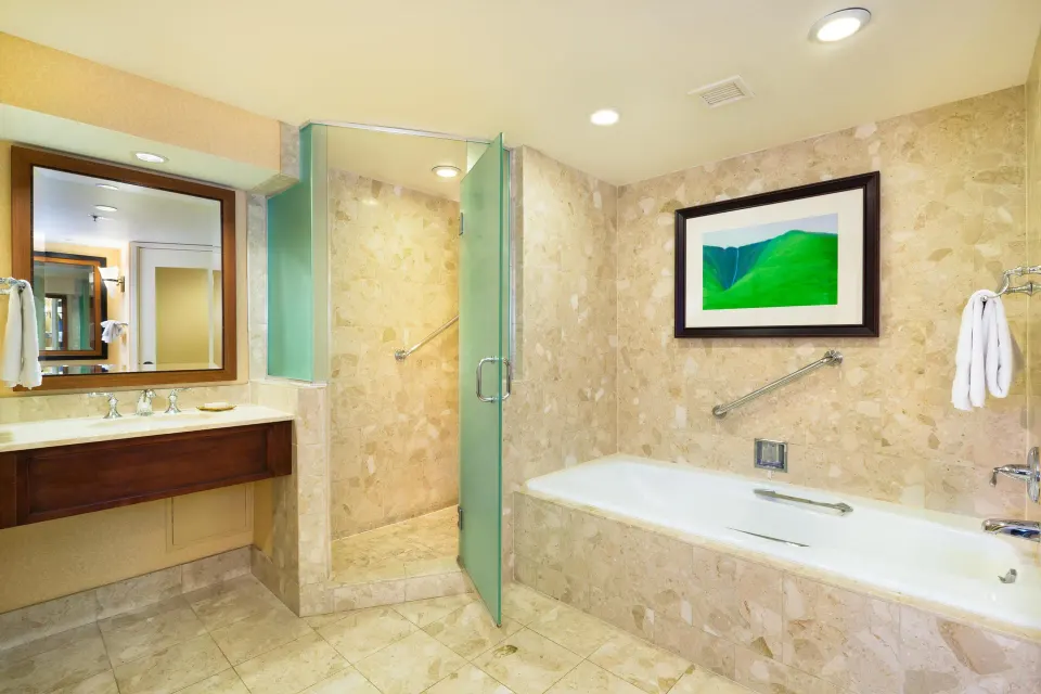 Makai One Bedroom Suite bathroom with built-in tub at Hilton Waikoloa Village